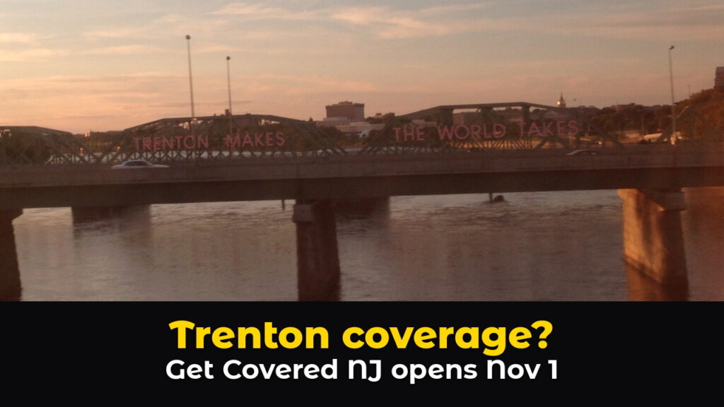 The Lower Trenton Bridge over the Delaware River at sunset, seen past a road bridge, with its red TRENTON MAKES THE WORLD TAKES letters and the State House dome in the distance, above hook text: Trenton coverage? Get Covered NJ opens Nov 1.