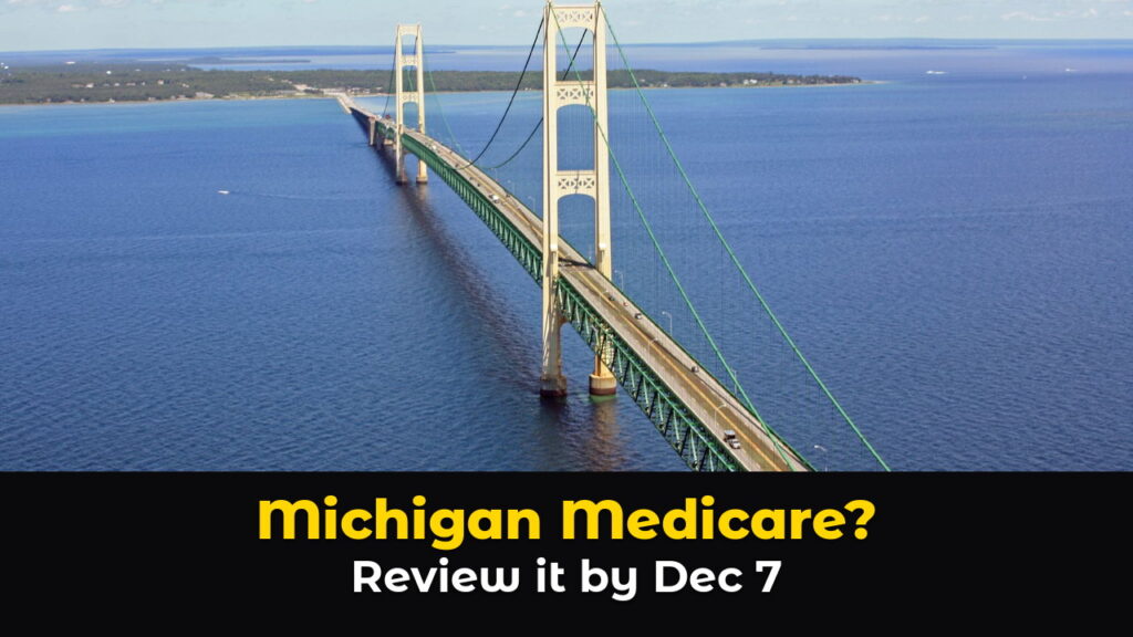 An aerial view of the Mackinac Bridge in Michigan, a long suspension bridge with two cream colored towers and green railings stretching across the deep blue Straits of Mackinac toward a wooded shoreline under white clouds, above hook text: Michigan Medicare? Review it by Dec 7.