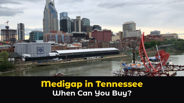 The downtown Nashville skyline seen from a pedestrian bridge over the Cumberland River, with the tall twin spired tower, brick riverfront buildings, and a red paddlewheel riverboat docked at the shore under a cloudy sky, above hook text: Medigap in Tennessee. When Can You Buy?