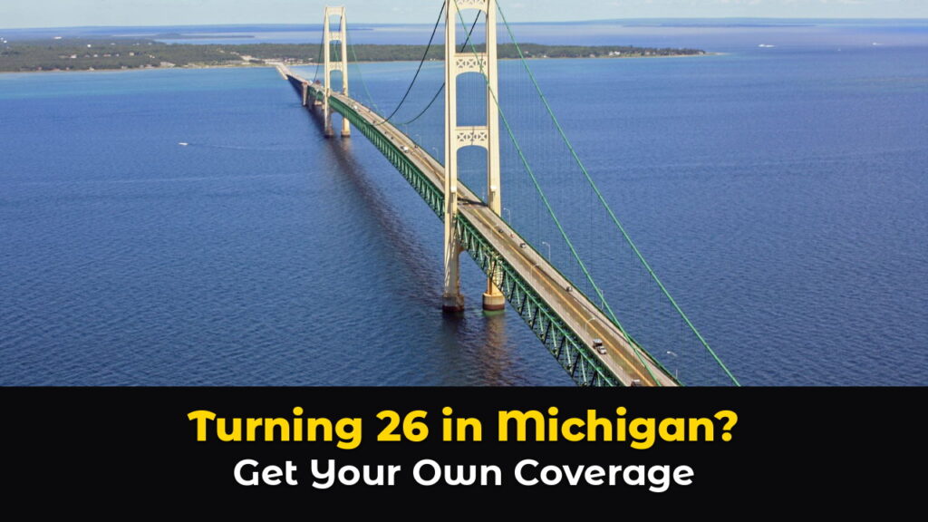 Aerial view of the Mackinac Bridge in Michigan, a long green suspension bridge with cars and a truck crossing over deep blue water, with the text: Turning 26 in Michigan? Get Your Own Coverage.